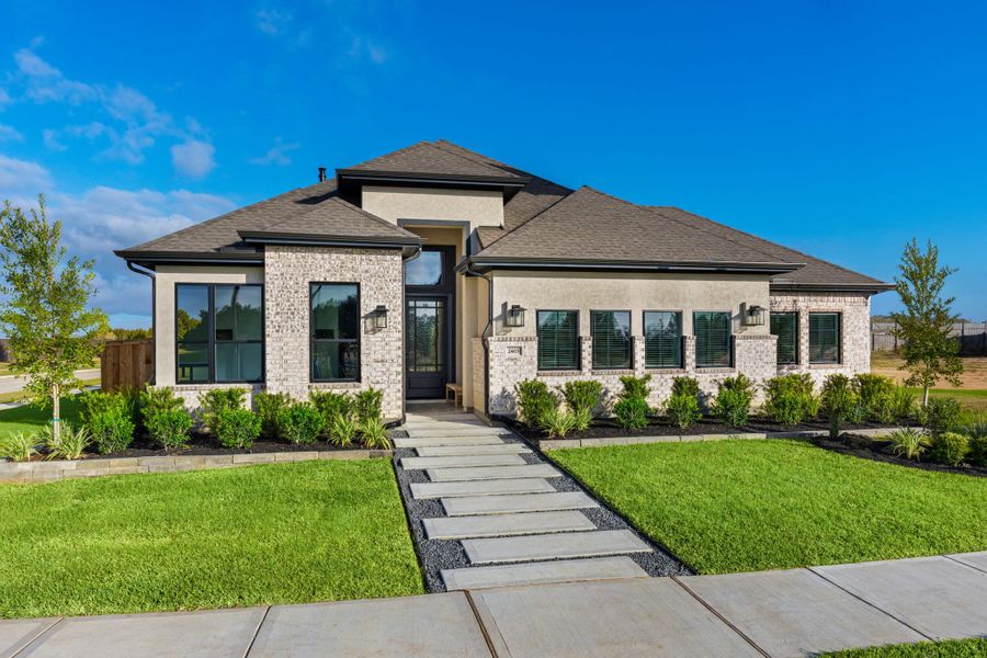Representative exterior photo of a completed home built from the Lauren by Chesmar Homes in Wood Leaf Reserve, Tomball, TX (Image 21).