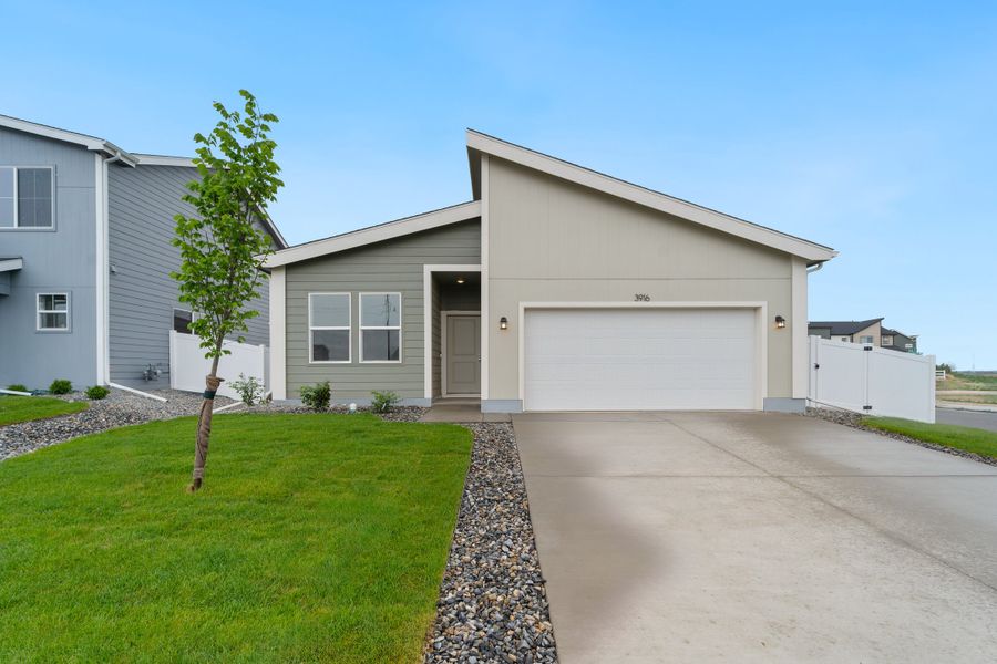 Front exterior of a new home in Liberty Draw, Evans, CO, highlighting curb appeal (Image 2). Front exterior of a new home in Liberty Draw, Evans, CO, highlighting curb appeal (Image 2).