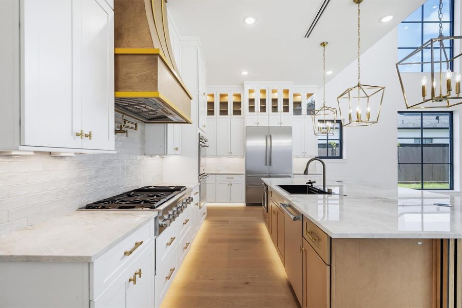 Included is a Thermador professional appliance package and custom lighting throughout.