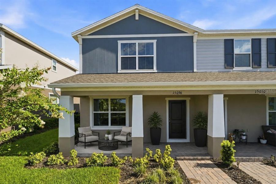 Front exterior of a new home in , Winter Garden, FL, highlighting curb appeal (Image 1). Front exterior of a new home in , Winter Garden, FL, highlighting curb appeal (Image 1).