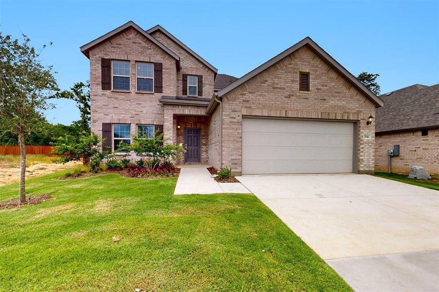 Front exterior of a new home in Kings Way, Denton, TX, highlighting curb appeal (Image 18). Front exterior of a new home in Kings Way, Denton, TX, highlighting curb appeal (Image 18).