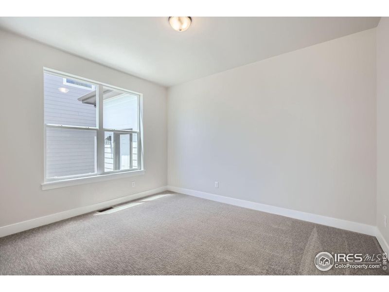 Spacious, unfurnished interior of a new home in RainDance National 60/70, Windsor (Image 17).