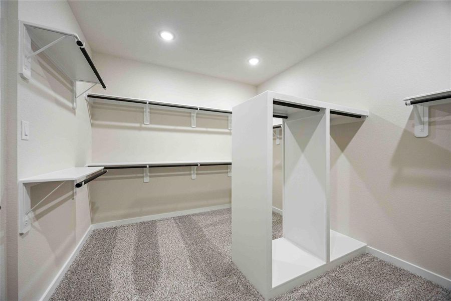 The luxurious owner's retreat is a private oasis with a spa-inspired bath and an extended walk-in closet.