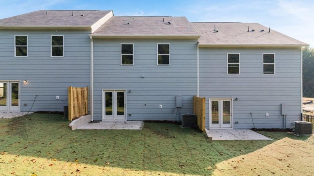 Exterior details and patio area of a home in Waypoint, Flowery Branch (Image 4).