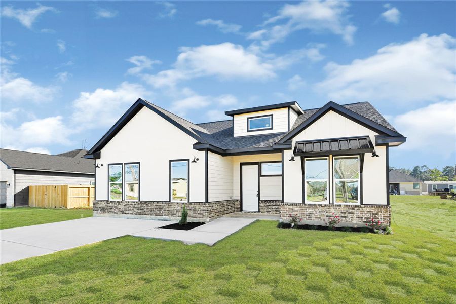 Front exterior of a new home in , Huffman, TX, highlighting curb appeal (Image 2). Front exterior of a new home in , Huffman, TX, highlighting curb appeal (Image 2).