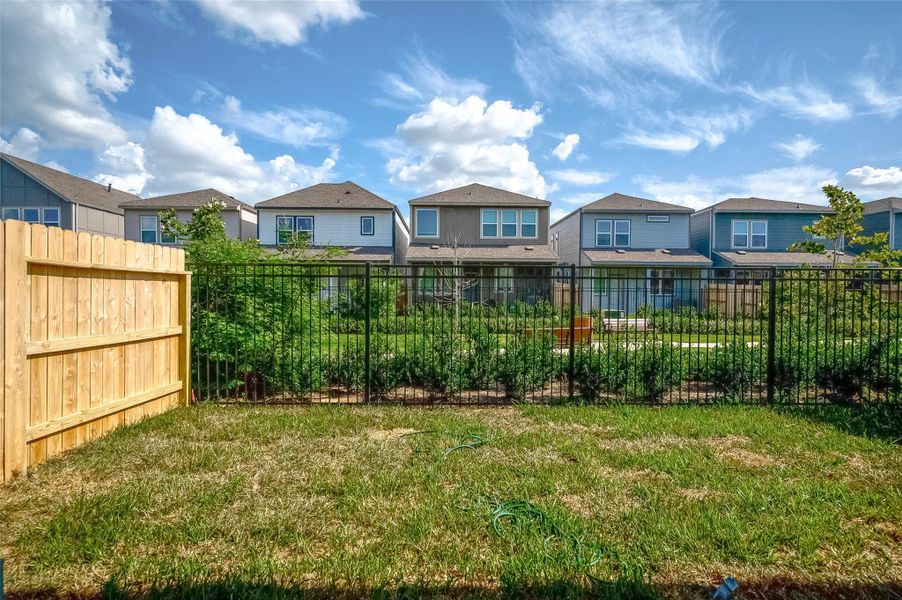 Front exterior of a new home in McClendon Park Village, Houston, TX, highlighting curb appeal (Image 29). Front exterior of a new home in McClendon Park Village, Houston, TX, highlighting curb appeal (Image 29).