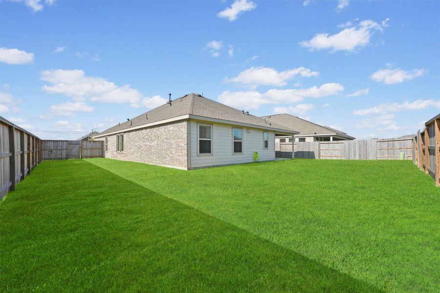 Exterior details and patio area of a home in Sterling Point at Baytown Crossings: Wildflower II Collection, Baytown (Image 19).