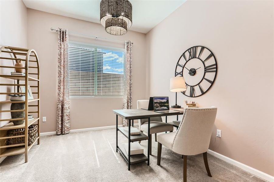 Office featuring light colored carpet and baseboards