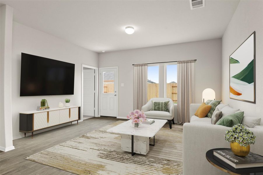 Living area featuring light wood-style flooring and baseboards