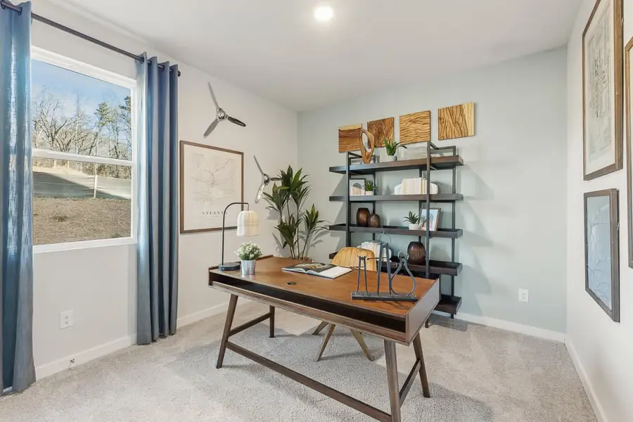 A room with a table and shelves.