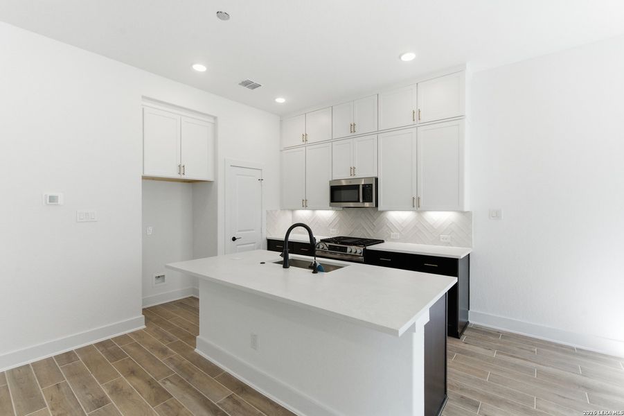Furnished interior view inside a new home in Rose Hill, San Antonio (Image 8).