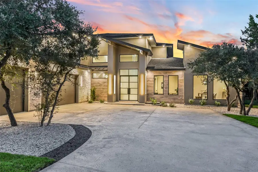 View of front of property featuring concrete driveway, stone siding, stucco siding, and a 3 car garage View of front of property featuring concrete driveway, stone siding, stucco siding, and a 3 car garage