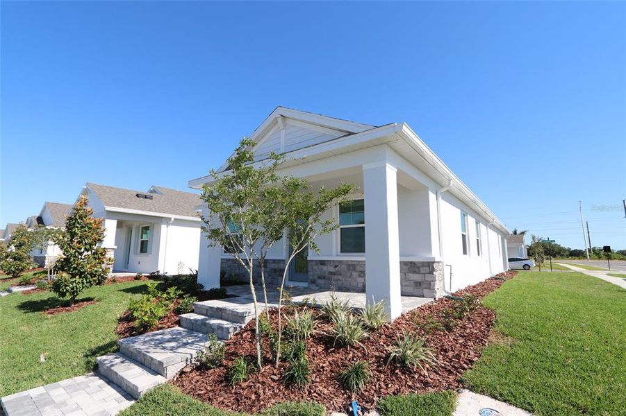 Front exterior of a new home in , Sarasota, FL, highlighting curb appeal (Image 14).