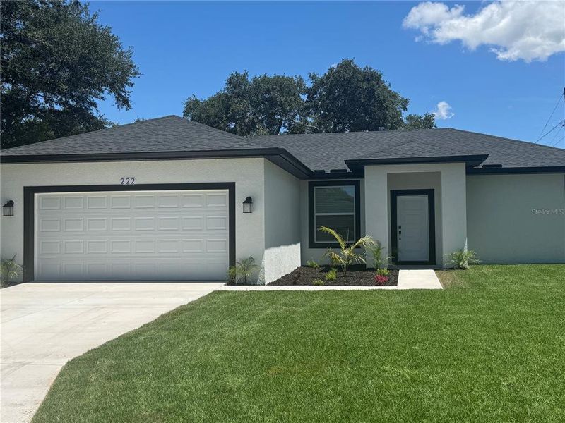 Front exterior of a new home in , Dundee, FL, highlighting curb appeal (Image 2). Front exterior of a new home in , Dundee, FL, highlighting curb appeal (Image 2).