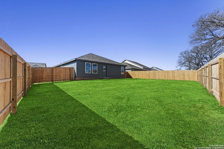 Exterior details and patio area of a home in Friendship Oaks, Fredericksburg (Image 2).