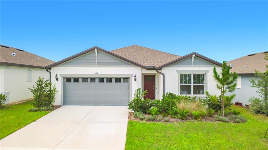 Front exterior of a new home in Lake Alfred Pines, Lake Alfred, FL, highlighting curb appeal (Image 21).
