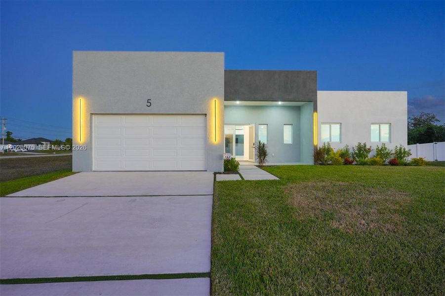 Front exterior of a new home in , Cape Coral, FL, highlighting curb appeal (Image 29). Front exterior of a new home in , Cape Coral, FL, highlighting curb appeal (Image 29).