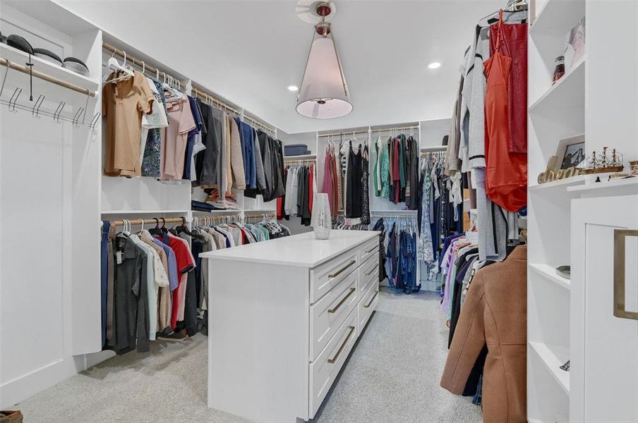 Walk in closet featuring light carpet