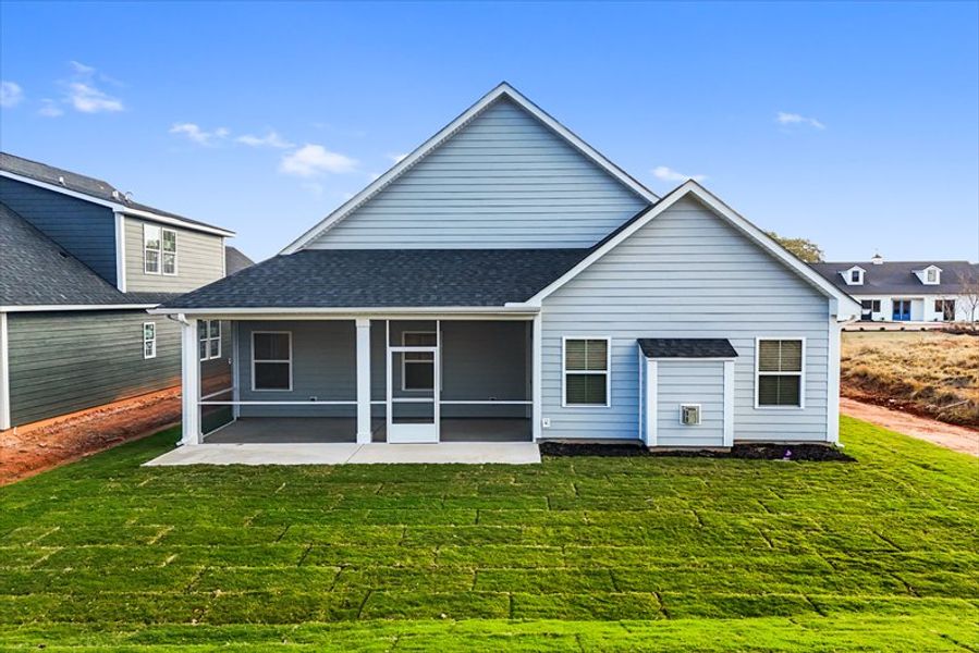 Exterior details and patio area of a home in Canterbrook Farms Ranches, Fountain Inn (Image 3).