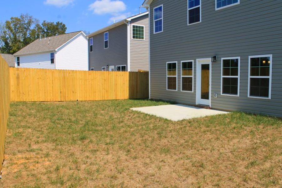 Exterior details and patio area of a home in The Wilcox, Greensboro (Image 3). Exterior details and patio area of a home in The Wilcox, Greensboro (Image 3).