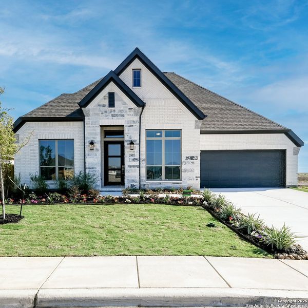 Front exterior of a new home in Meadows Of Mill Creek 60', Seguin, TX, highlighting curb appeal (Image 1).
