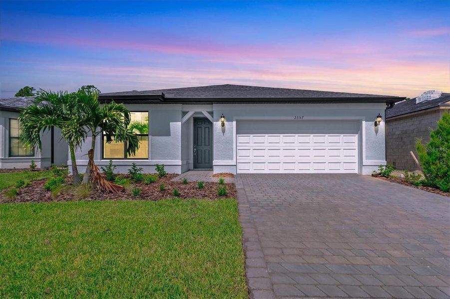 Front exterior of a new home in , North Port, FL, highlighting curb appeal (Image 1). Front exterior of a new home in , North Port, FL, highlighting curb appeal (Image 1).