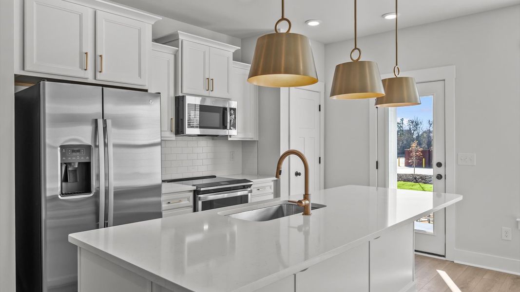 Accomplished layout with a stunning 9-foot island, pendant lighting, and superior craftsmanship