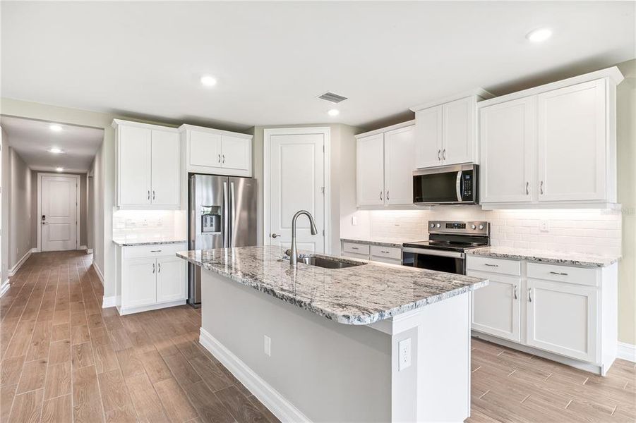 Furnished interior view inside a new home in Burnt Store Village, Punta Gorda (Image 8).