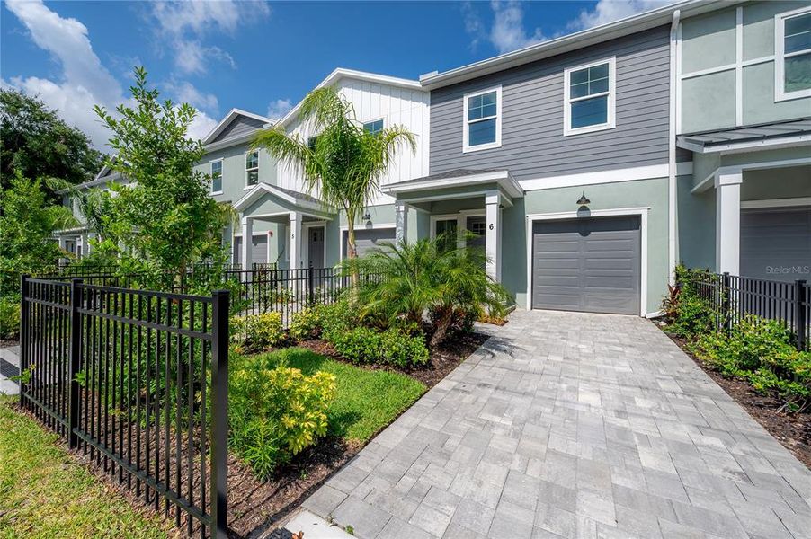 Front exterior of a new home in , Tampa, FL, highlighting curb appeal (Image 24).