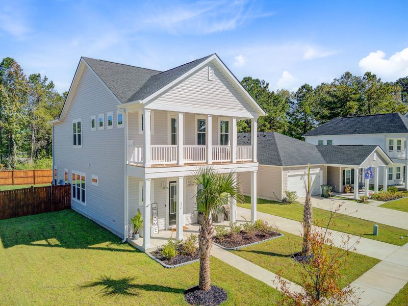 Front exterior of a new home in Limehouse Village: Row Collection, Summerville, SC, highlighting curb appeal (Image 25).