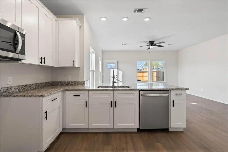 A thoughtfully designed kitchen combining timeless finishes and modern functionality, creating a welcoming centerpiece of the home.