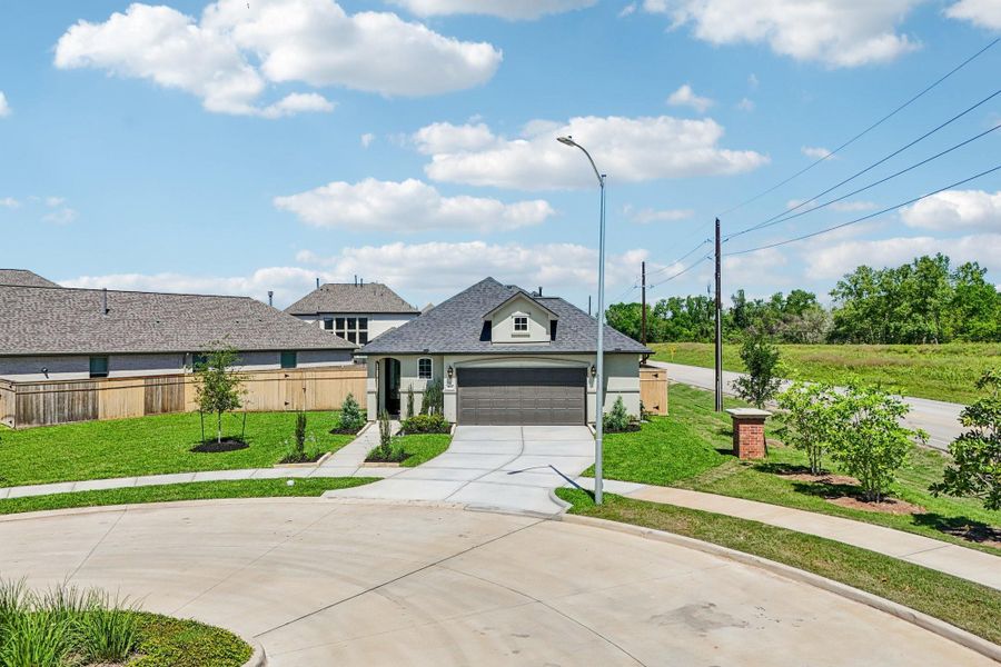 Front exterior of a new home in Sienna 40', Missouri City, TX, highlighting curb appeal (Image 18).