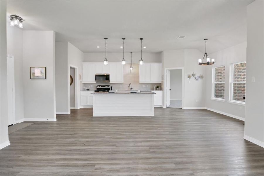 View from living area towards kitchen and dining.