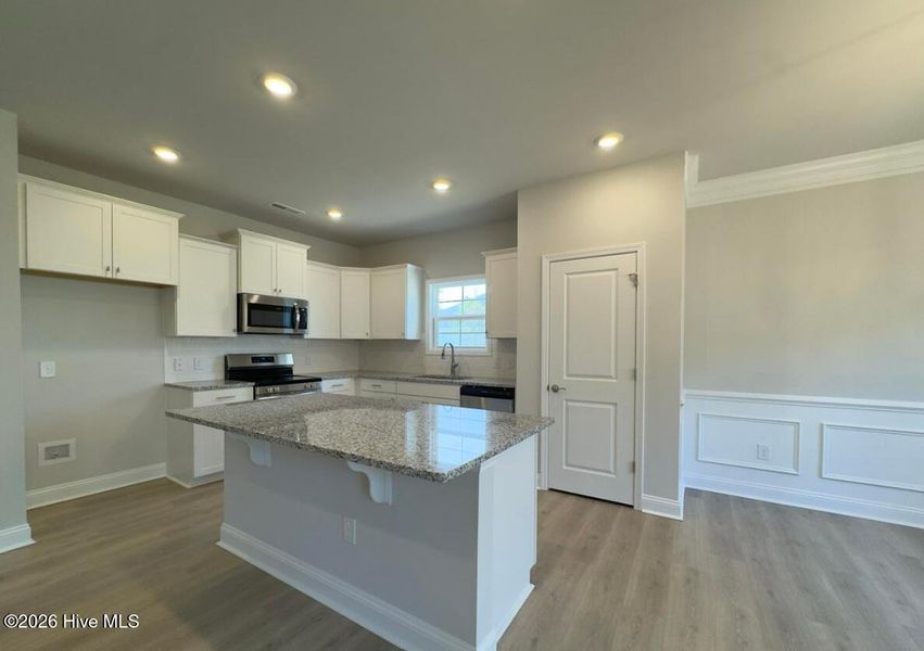 Furnished interior view inside a new home in River Village Square in River Landing, Wallace (Image 4).
