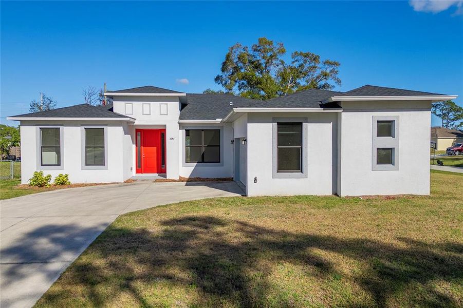 Front exterior of a new home in , Palm Bay, FL, highlighting curb appeal (Image 1). Front exterior of a new home in , Palm Bay, FL, highlighting curb appeal (Image 1).