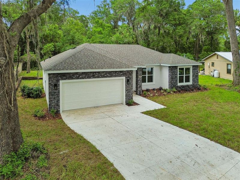 Front exterior of a new home in , Deland, FL, highlighting curb appeal (Image 26).