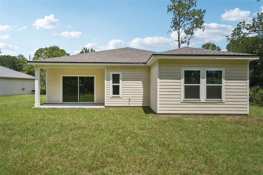 Exterior details and patio area of a home in , Palm Coast (Image 21).