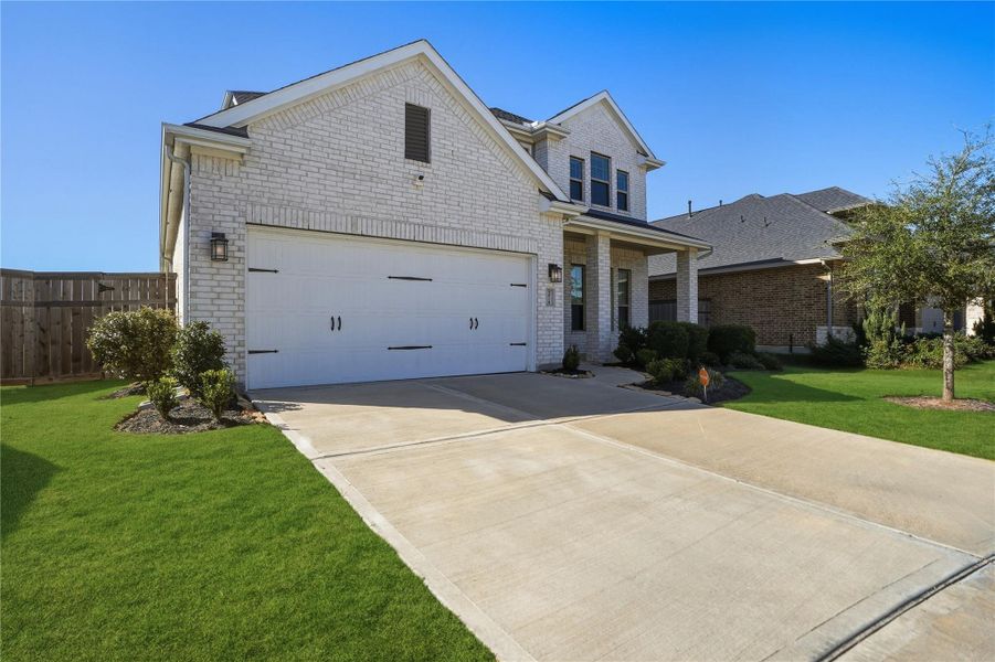 Front exterior of a new home in , Fulshear, TX, highlighting curb appeal (Image 28). Front exterior of a new home in , Fulshear, TX, highlighting curb appeal (Image 28).