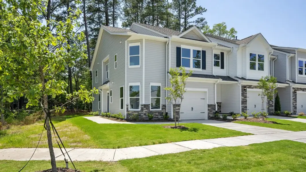 Front exterior of a new home in Copper Run South, Durham, NC, highlighting curb appeal (Image 2). Front exterior of a new home in Copper Run South, Durham, NC, highlighting curb appeal (Image 2).