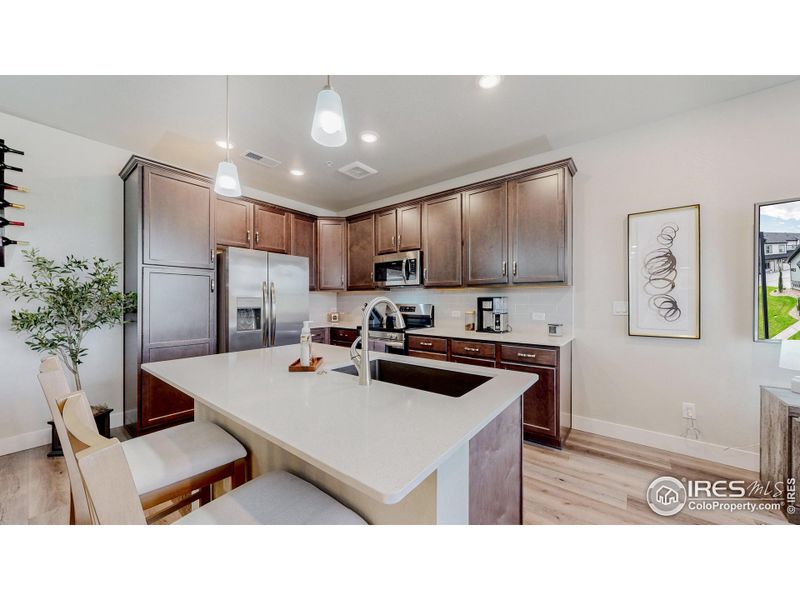 Quartz counters and soft close hinges added to all cabinetry in kitchen and bathrooms
