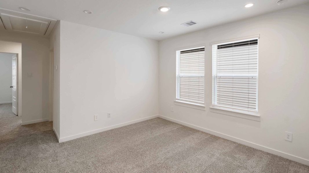 Representative unfurnished interior of a home built from the Iris by D.R. Horton in City Gate North, Houston (Image 10).