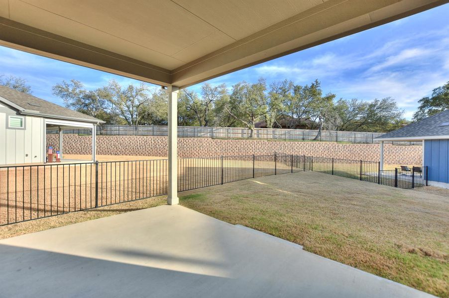 View of yard featuring a fenced backyard and a patio