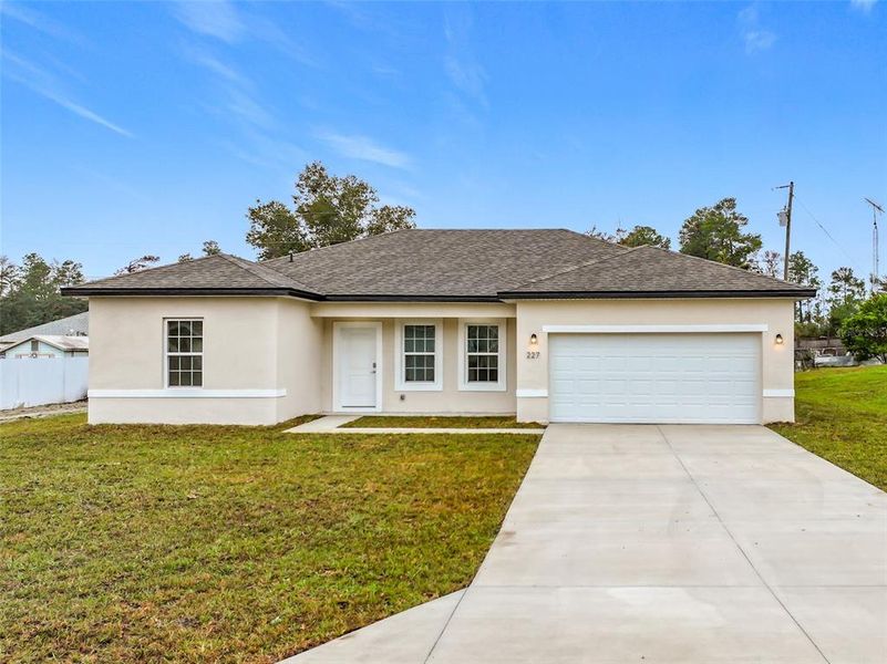 Front exterior of a new home in , Ocala, FL, highlighting curb appeal (Image 2). Front exterior of a new home in , Ocala, FL, highlighting curb appeal (Image 2).