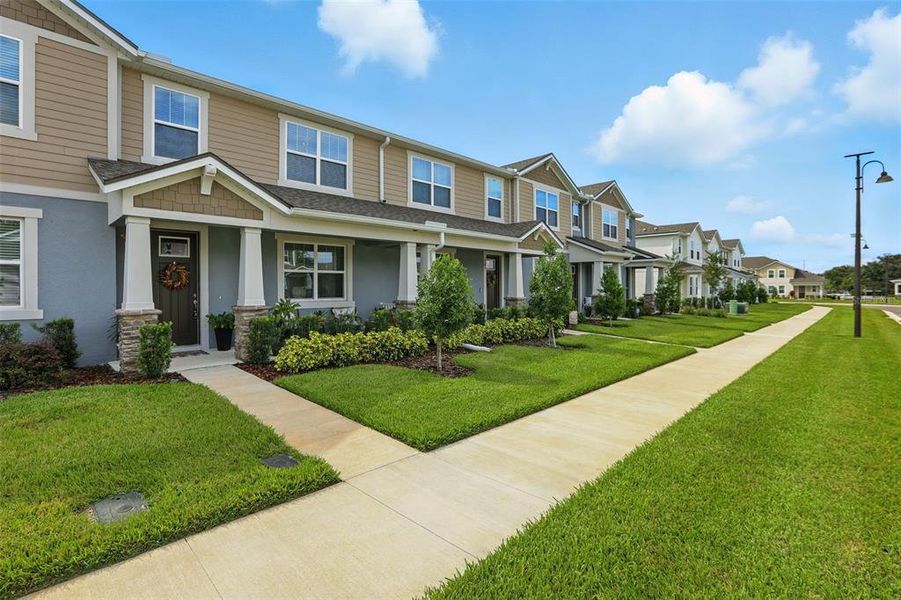 Front exterior of a new home in Waterbrooke, Clermont, FL, highlighting curb appeal (Image 24). Front exterior of a new home in Waterbrooke, Clermont, FL, highlighting curb appeal (Image 24).