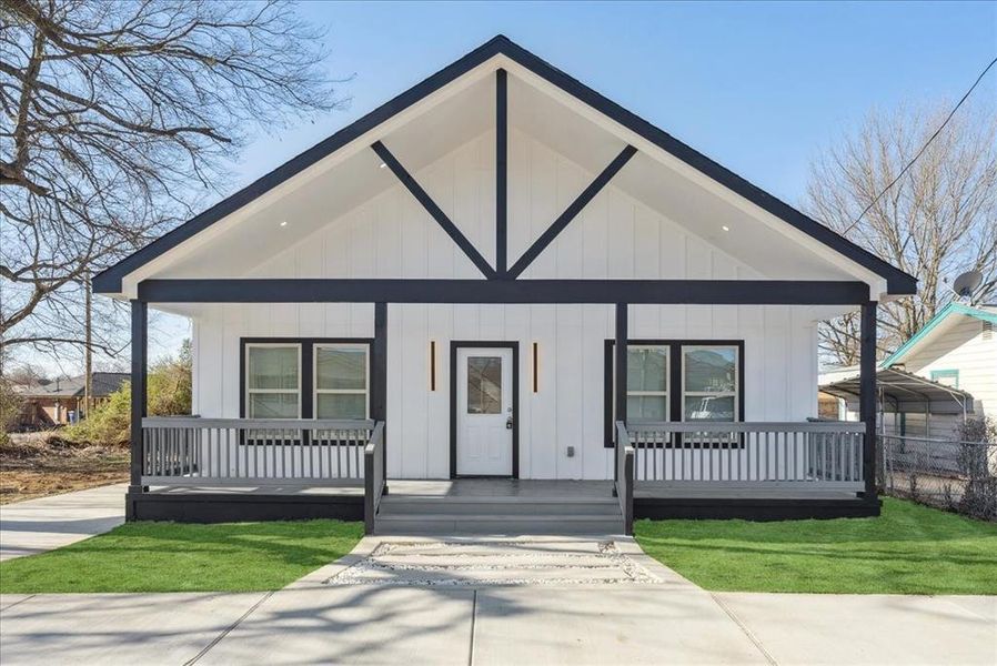 Modern farmhouse style home featuring board and batten siding and covered porch