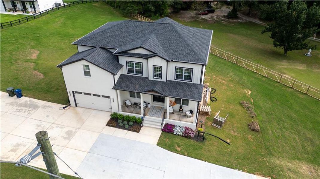 Front exterior of a new home in , Snellville, GA, highlighting curb appeal (Image 24). Front exterior of a new home in , Snellville, GA, highlighting curb appeal (Image 24).