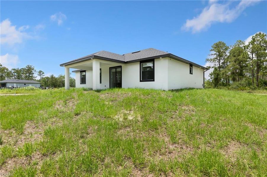 Exterior details and patio area of a home in , Lehigh Acres (Image 13). Exterior details and patio area of a home in , Lehigh Acres (Image 13).