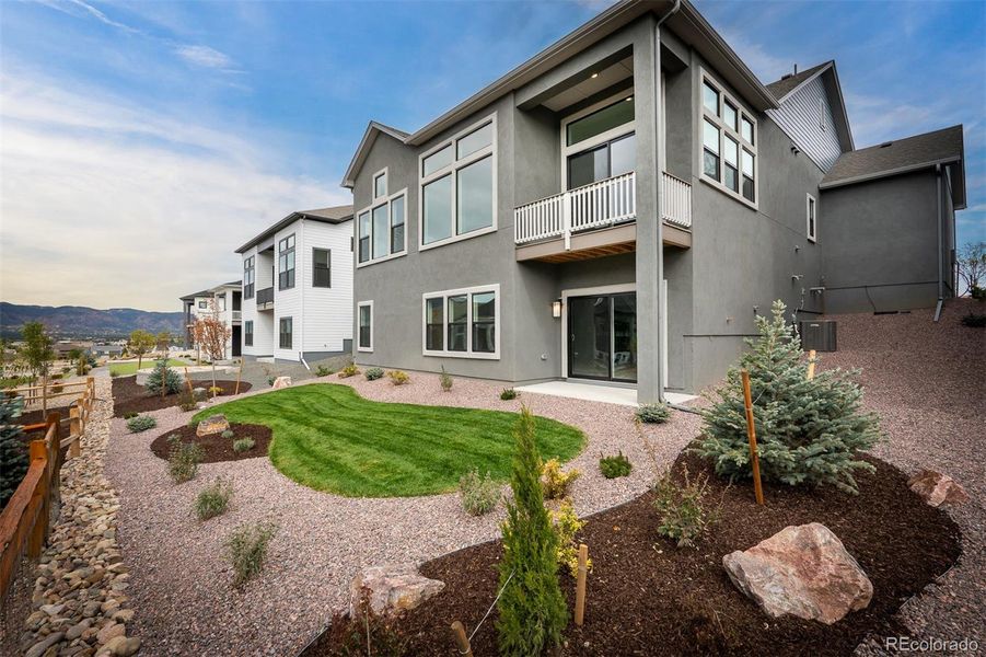 Exterior details and patio area of a home in Cloverleaf - Pinnacle Collection, Monument (Image 23).