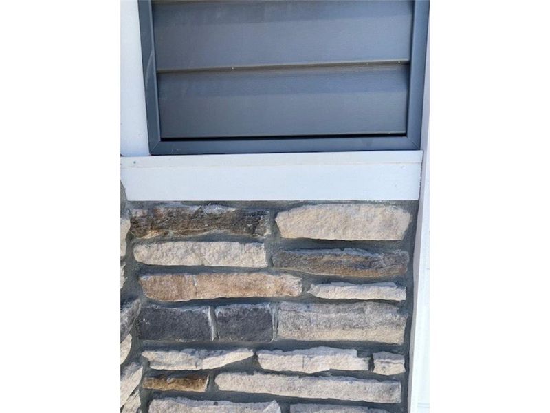 This exterior detail showcases a combination of st