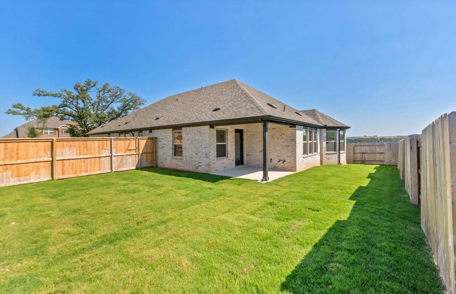 Exterior details and patio area of a home in Crescent Bluff, Georgetown (Image 4).